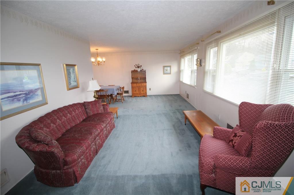 25 Montview Road Edison, NJ 08837 - Photo 8 of 21 a living room with furniture and a large window