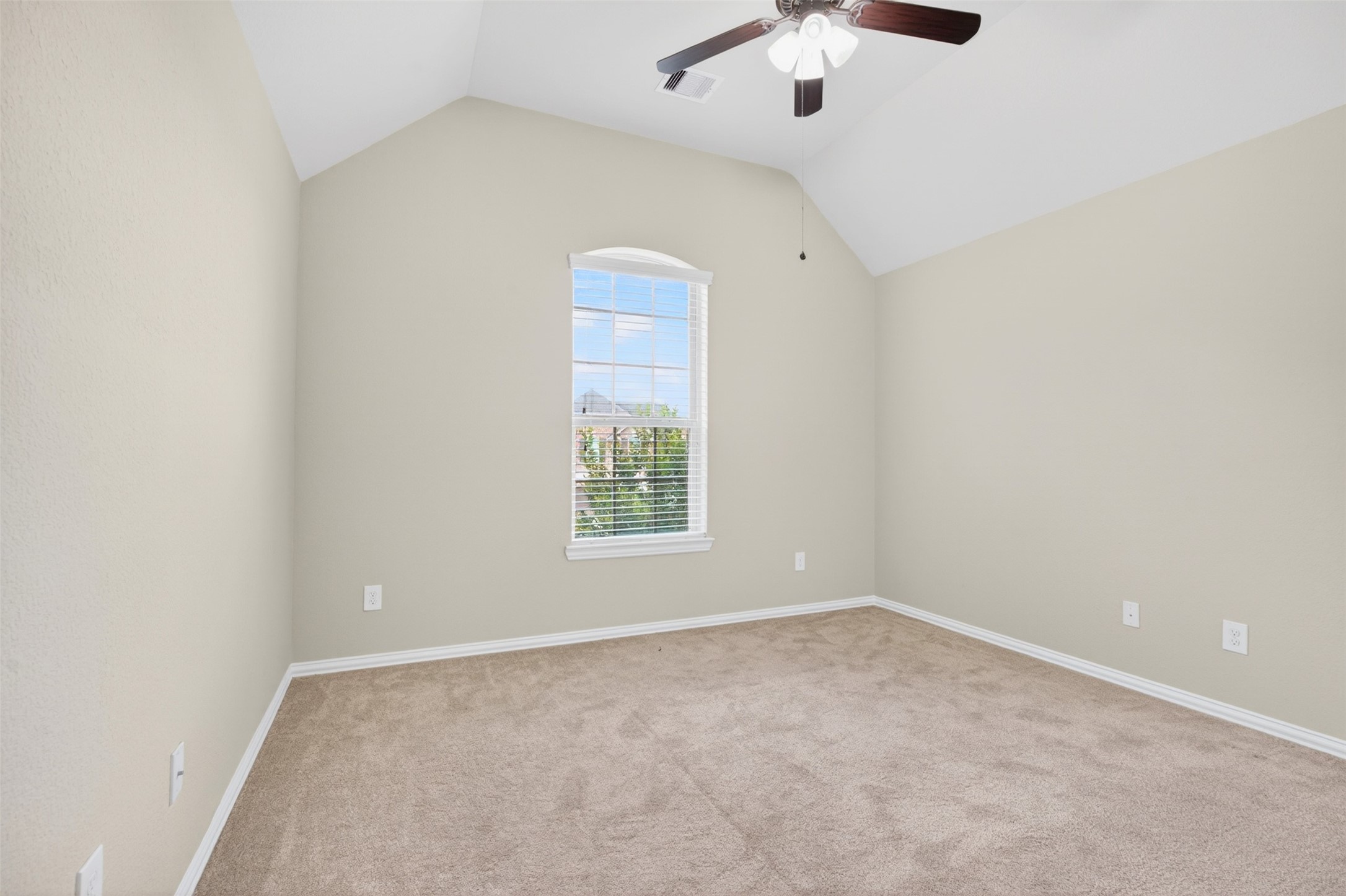 18202 Wedgewood Bluff Court Spring, TX 77379 - Photo 40 of 50 Additional secondary bedroom with vaulted ceiling and natural light.