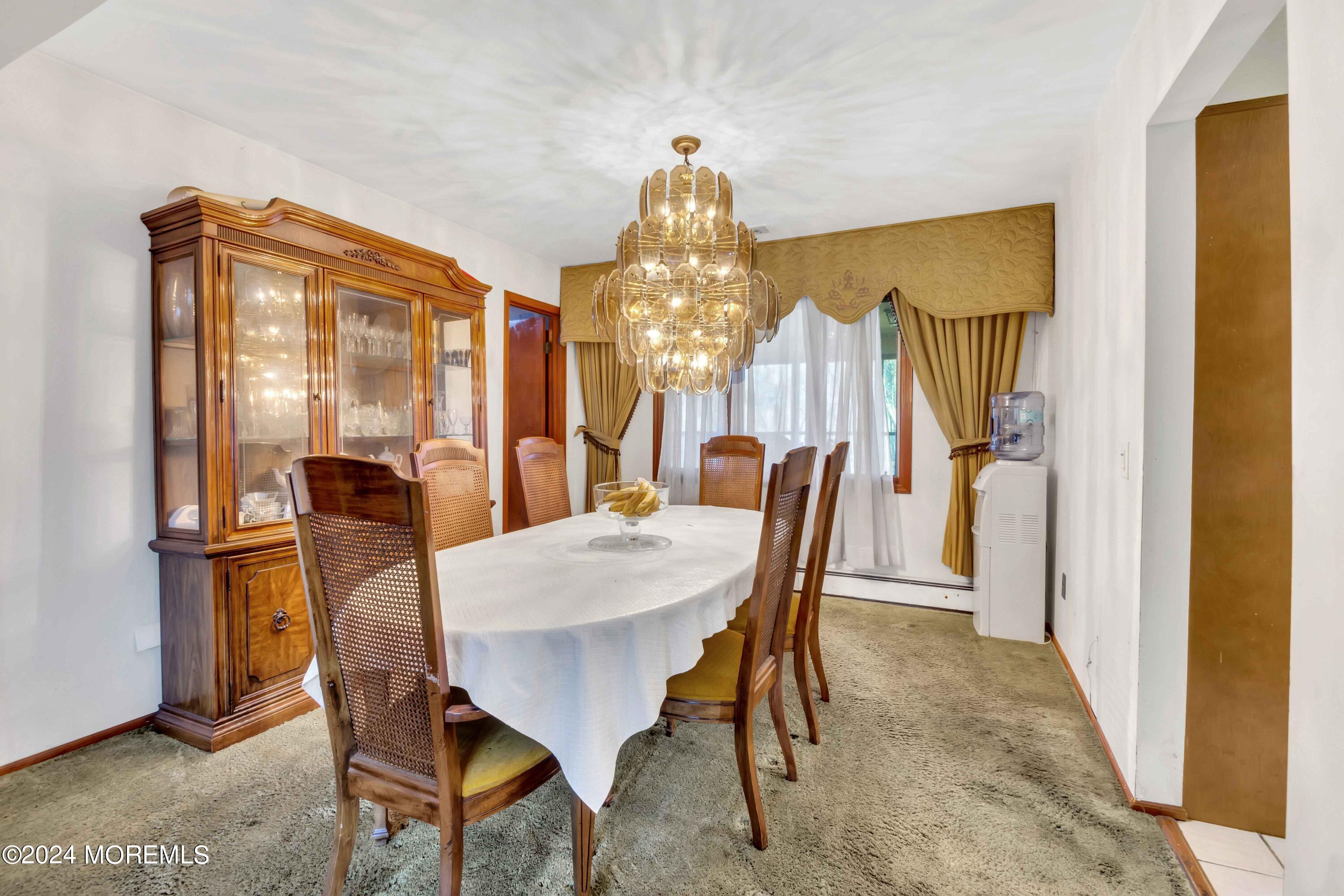 109 Crine Road Morganville, NJ 07751 - Photo 12 of 26 a view of a dining room with furniture and window