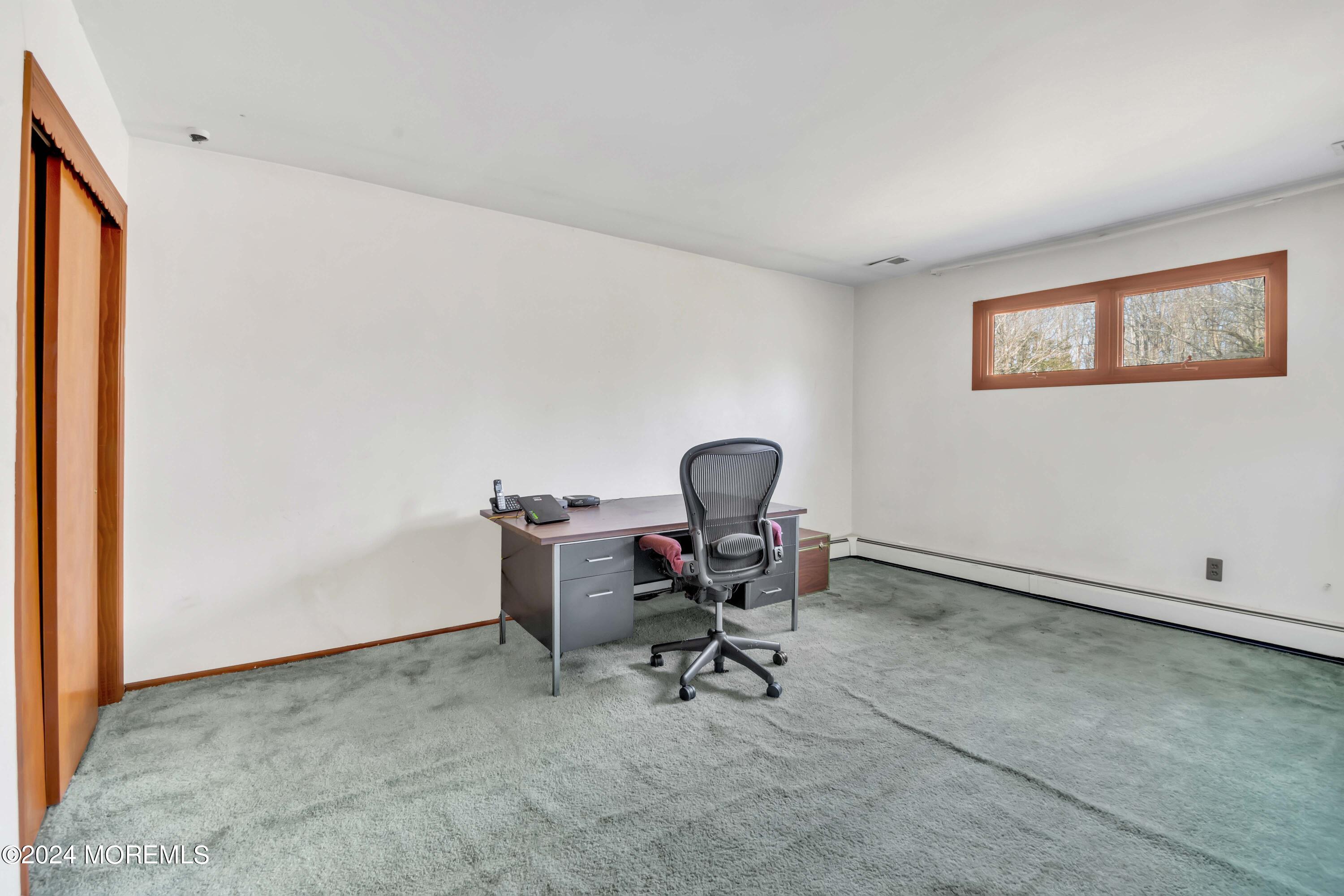 109 Crine Road Morganville, NJ 07751 - Photo 23 of 26 a work room with table and a chair