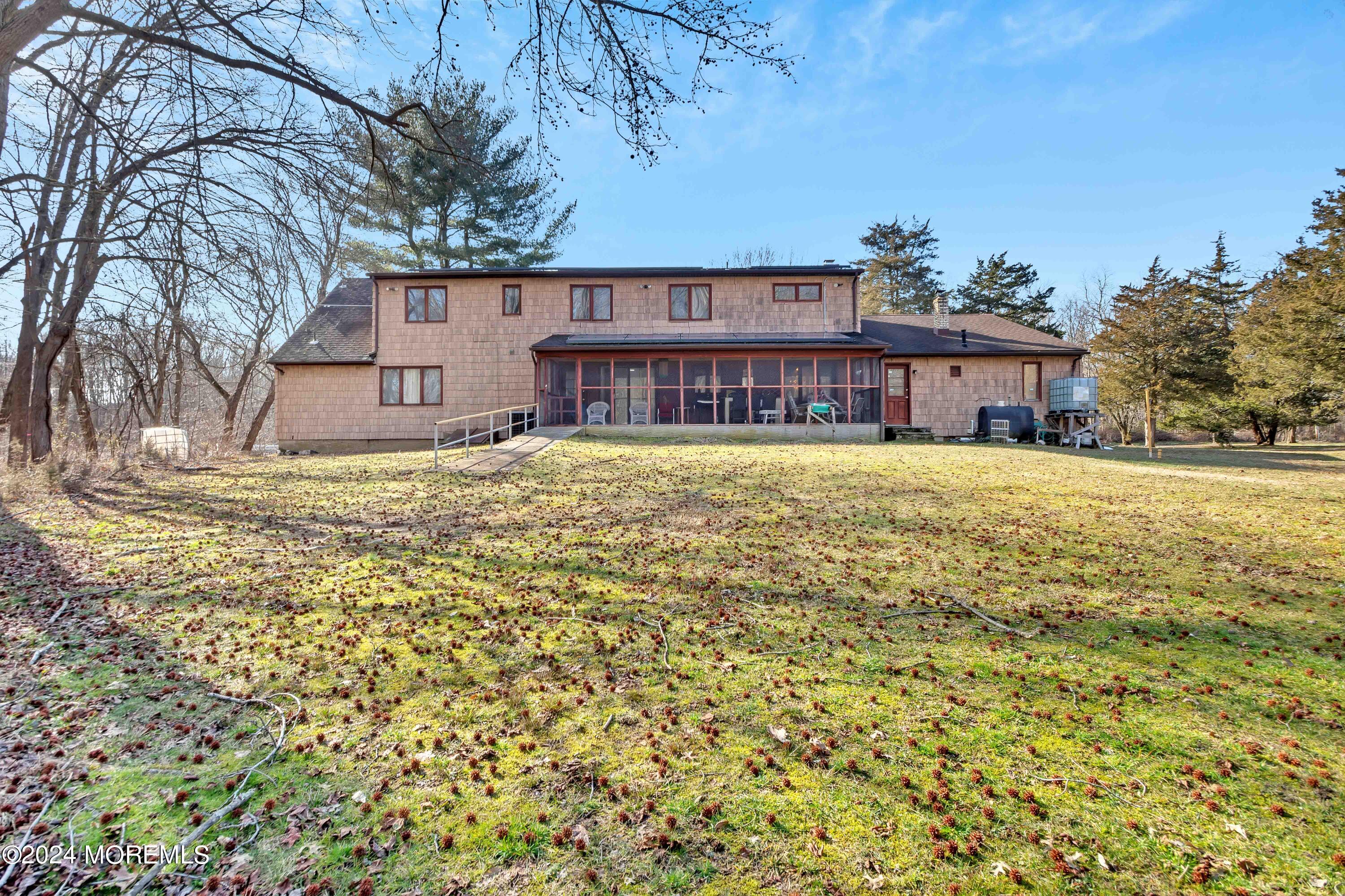 109 Crine Road Morganville, NJ 07751 - Photo 24 of 26 a house view with a garden space