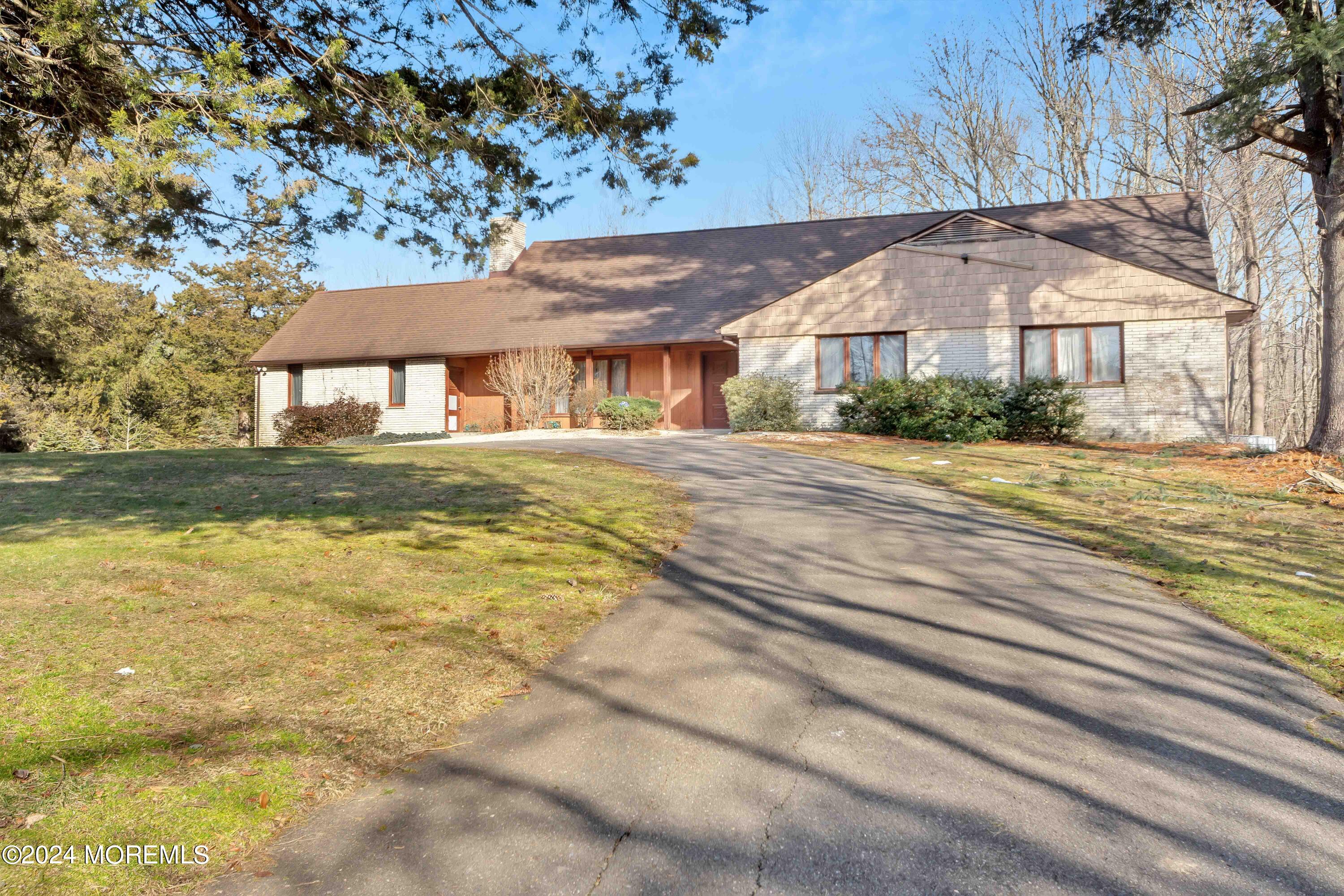109 Crine Road Morganville, NJ 07751 - Photo 6 of 26 a front view of a house with a yard