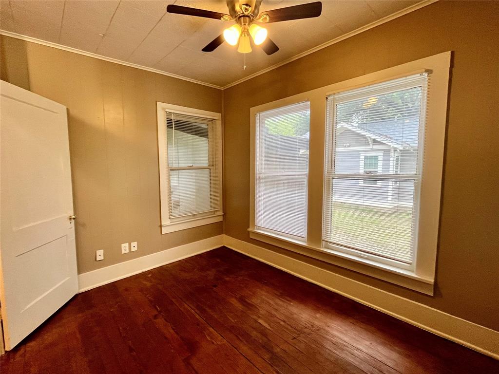 1002 Gregg Street, Unit CB Denton, TX 76201 - Photo 9 of 11 Here is a bedroom. Notice all of the natural lighting coming from the windows.