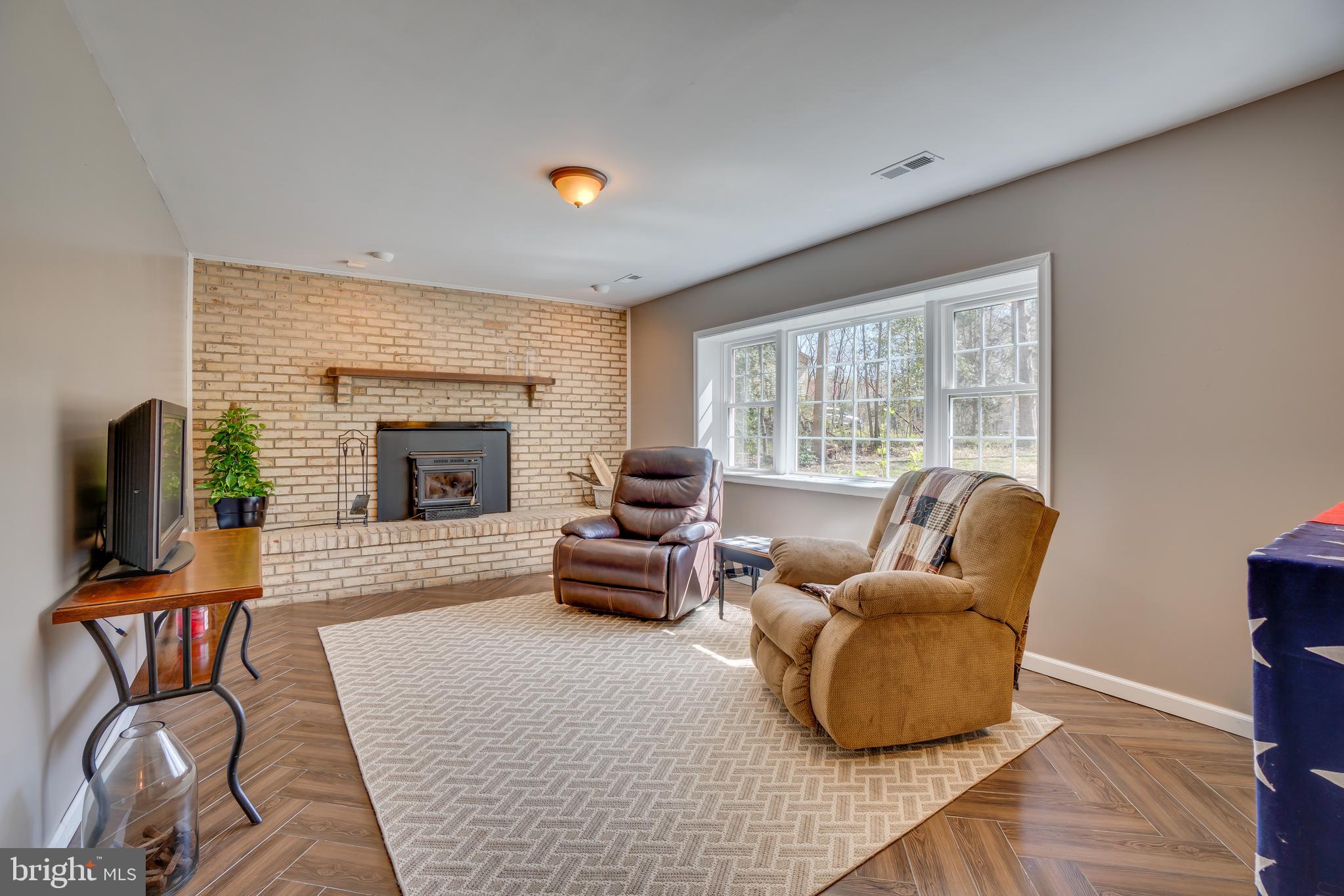 119 Fence Post Road Stafford, VA 22556 - Photo 19 of 30 Lower Level Rec Room w/ Wood Stove