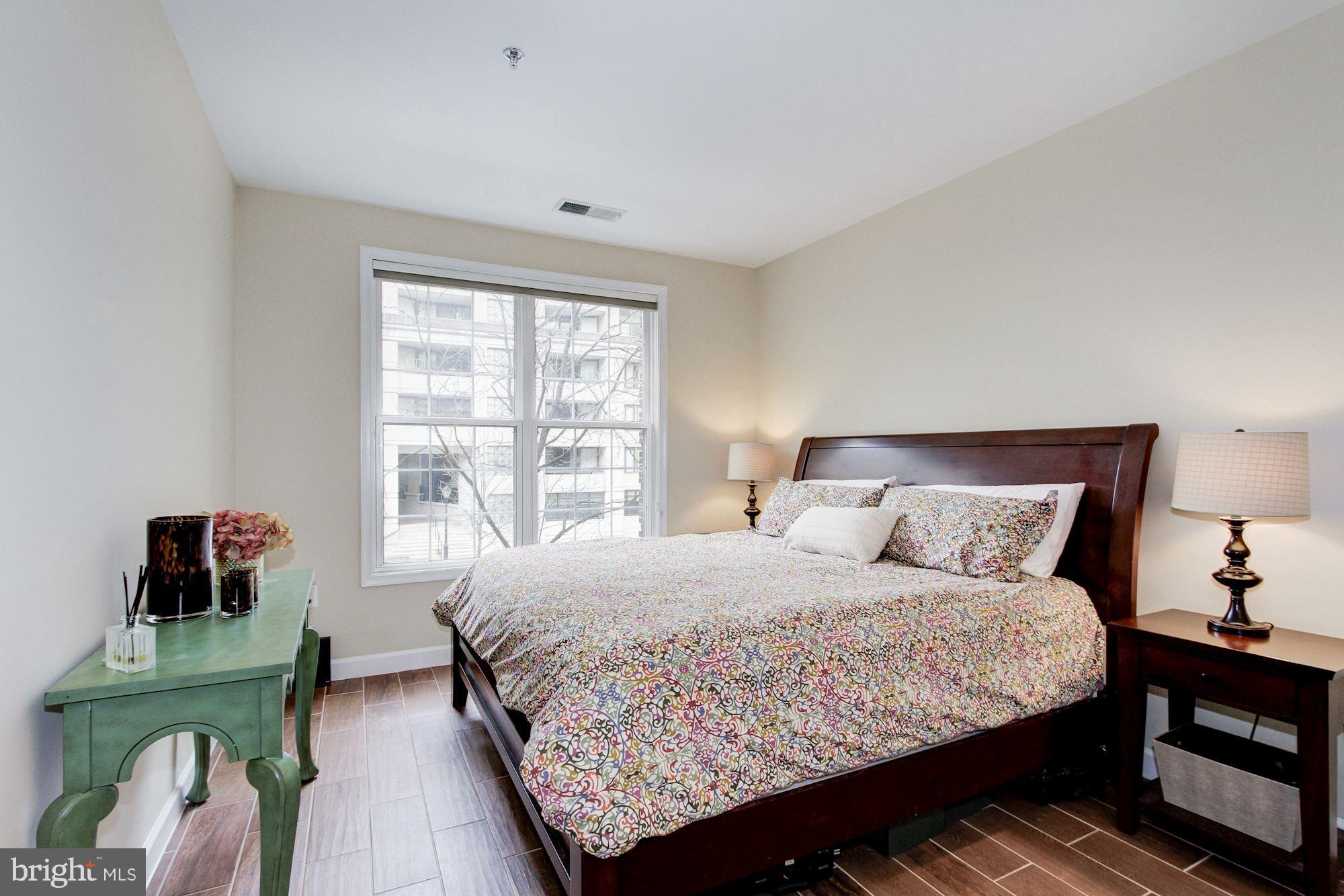 2310 14th Street North, Unit 108 Arlington, VA 22201 - Photo 12 of 22 a bedroom with a bed and a window