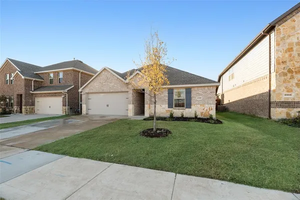 a house view with a garden space