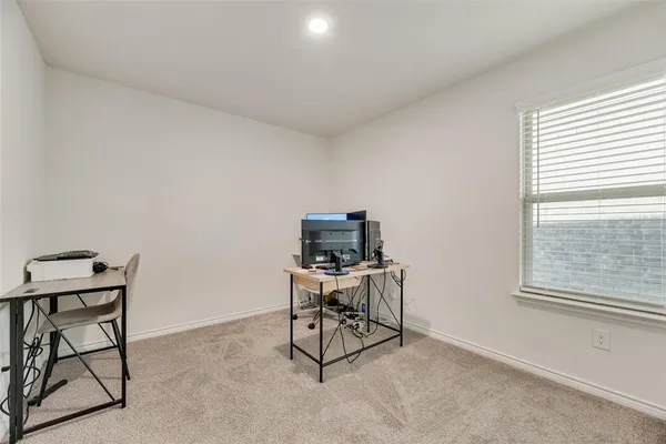 a bedroom with furniture and a window