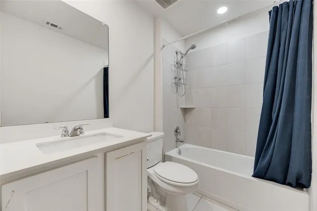 a view of bathroom with double sink and mirror