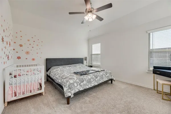 a bedroom with a bed and a cabinets