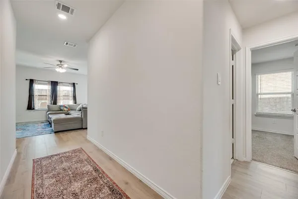 a view of a bedroom from the hallway