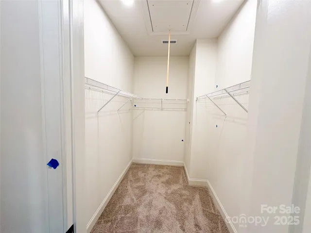 a view of a room with racks on the wall