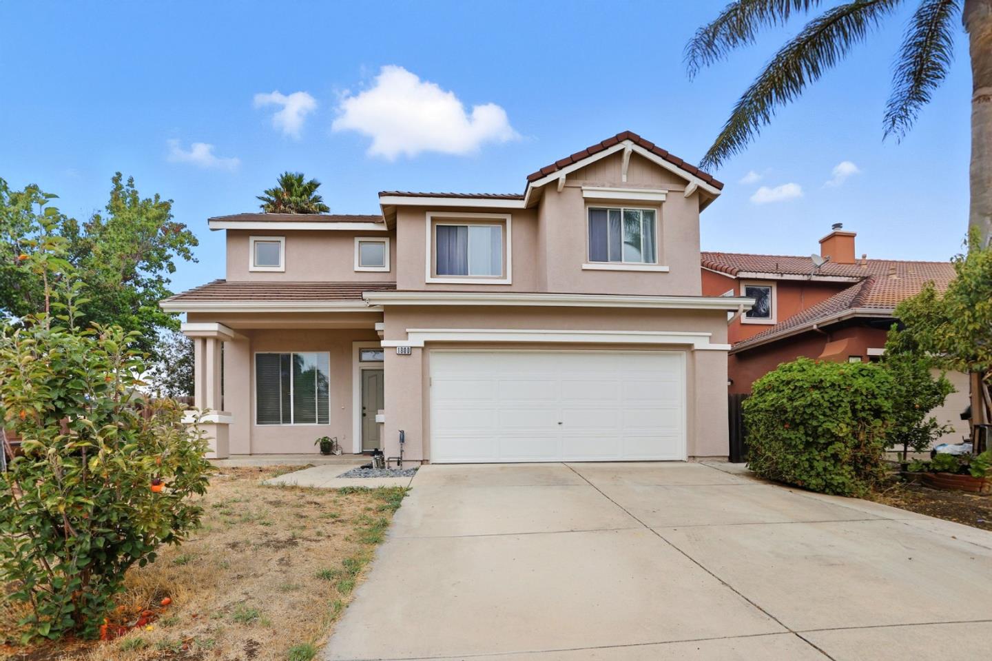 a front view of a house with yard