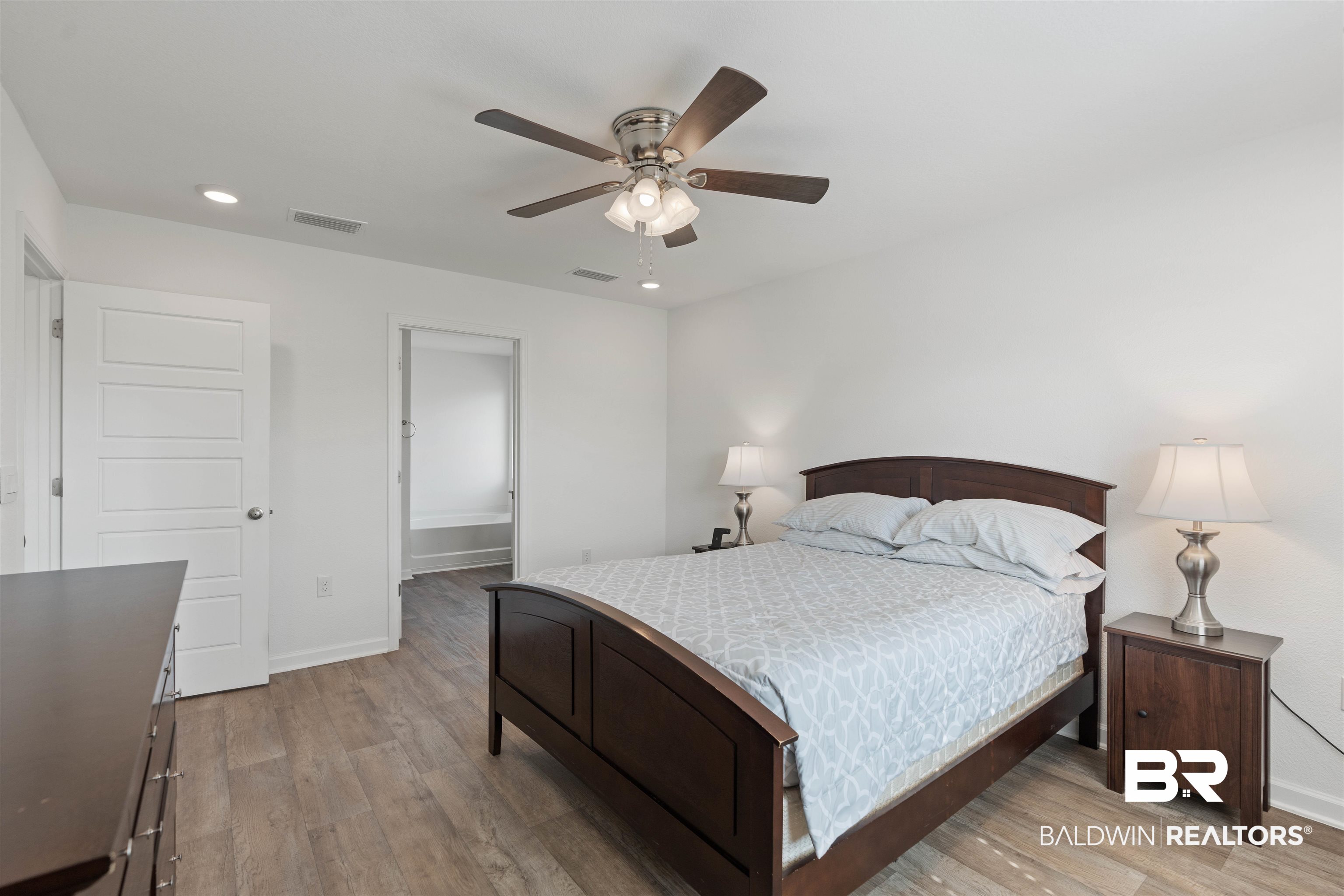 15030 Forsythia Loop Silverhill, AL 36576 - Photo 14 of 33 Bedroom featuring light wood-style flooring, ceiling fan, and recessed lighting
