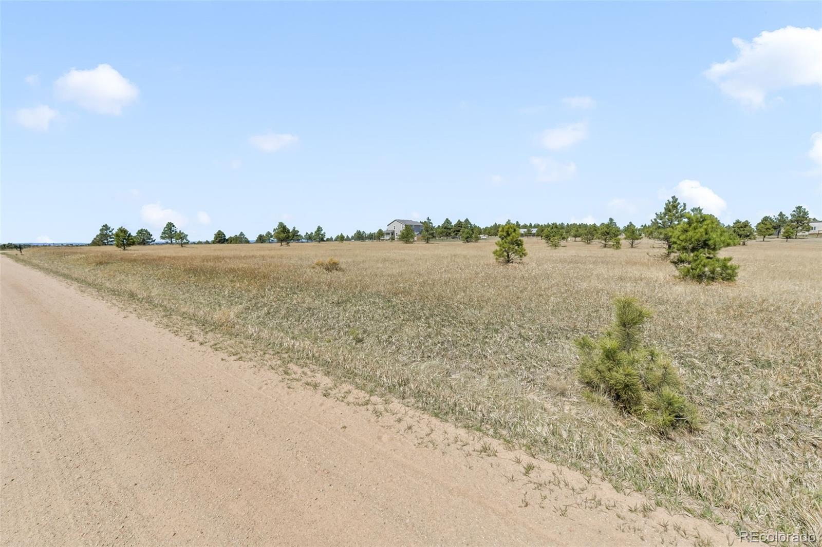 18150 Pinon Park Road Peyton, CO 80831 - Photo 19 of 45 a view of an ocean and beach