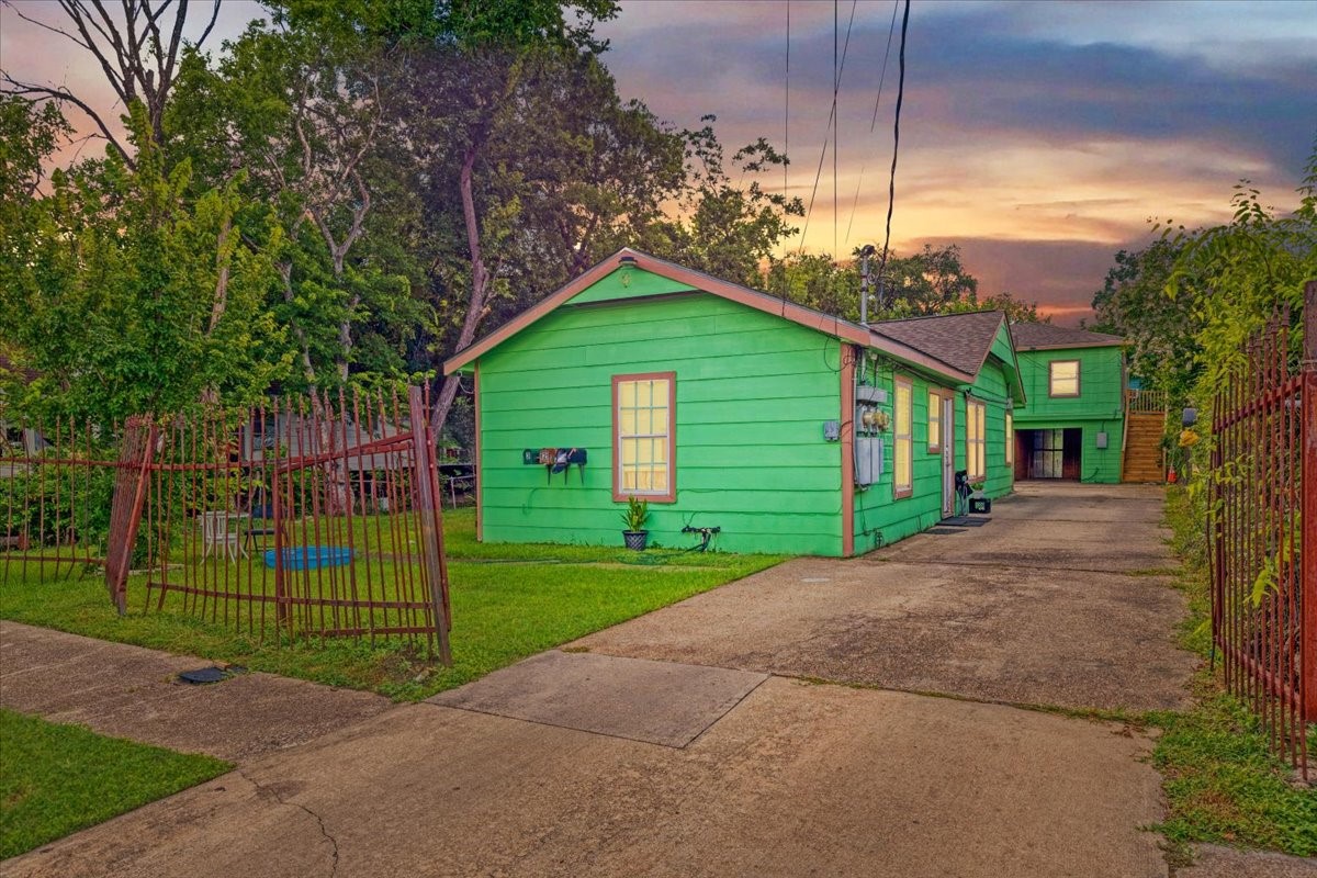 305 Johnson Street Pasadena, TX 77506 - Photo 2 of 9 a view of a house with a big yard plants and large trees