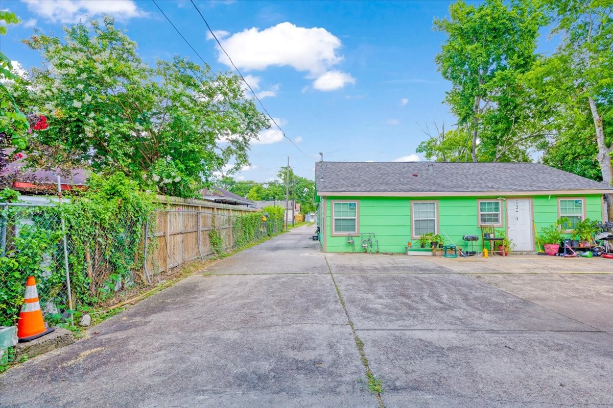 305 Johnson Street Pasadena, TX 77506 - Photo 4 of 9 a view of a house with a yard and potted plants