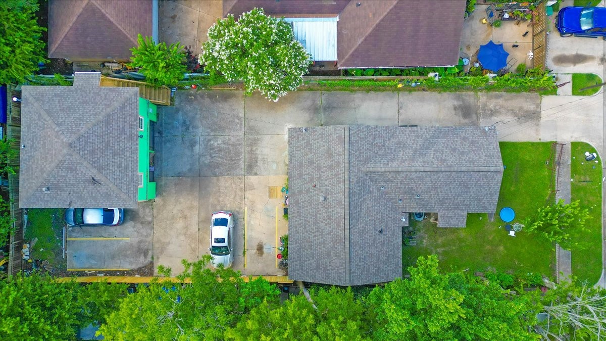 305 Johnson Street Pasadena, TX 77506 - Photo 8 of 9 an aerial view of a house with a yard and a bench