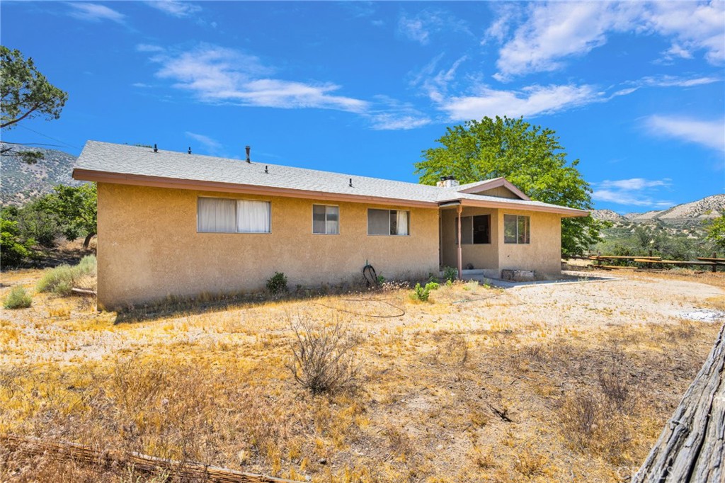 5500 Oil Well Road Phelan, CA 92371 - Photo 46 of 65 a front view of a house with a yard