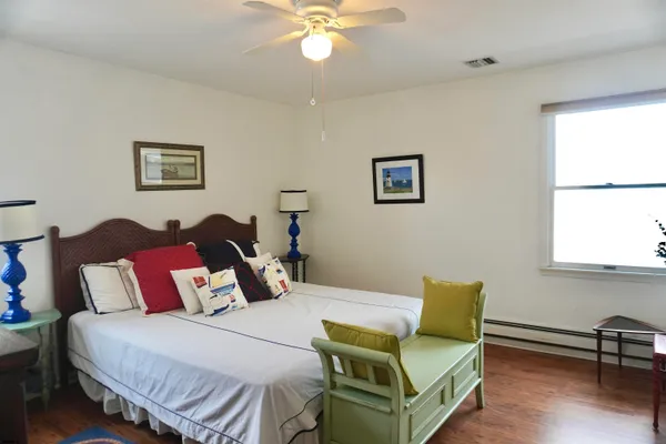 a bedroom with two beds and a window