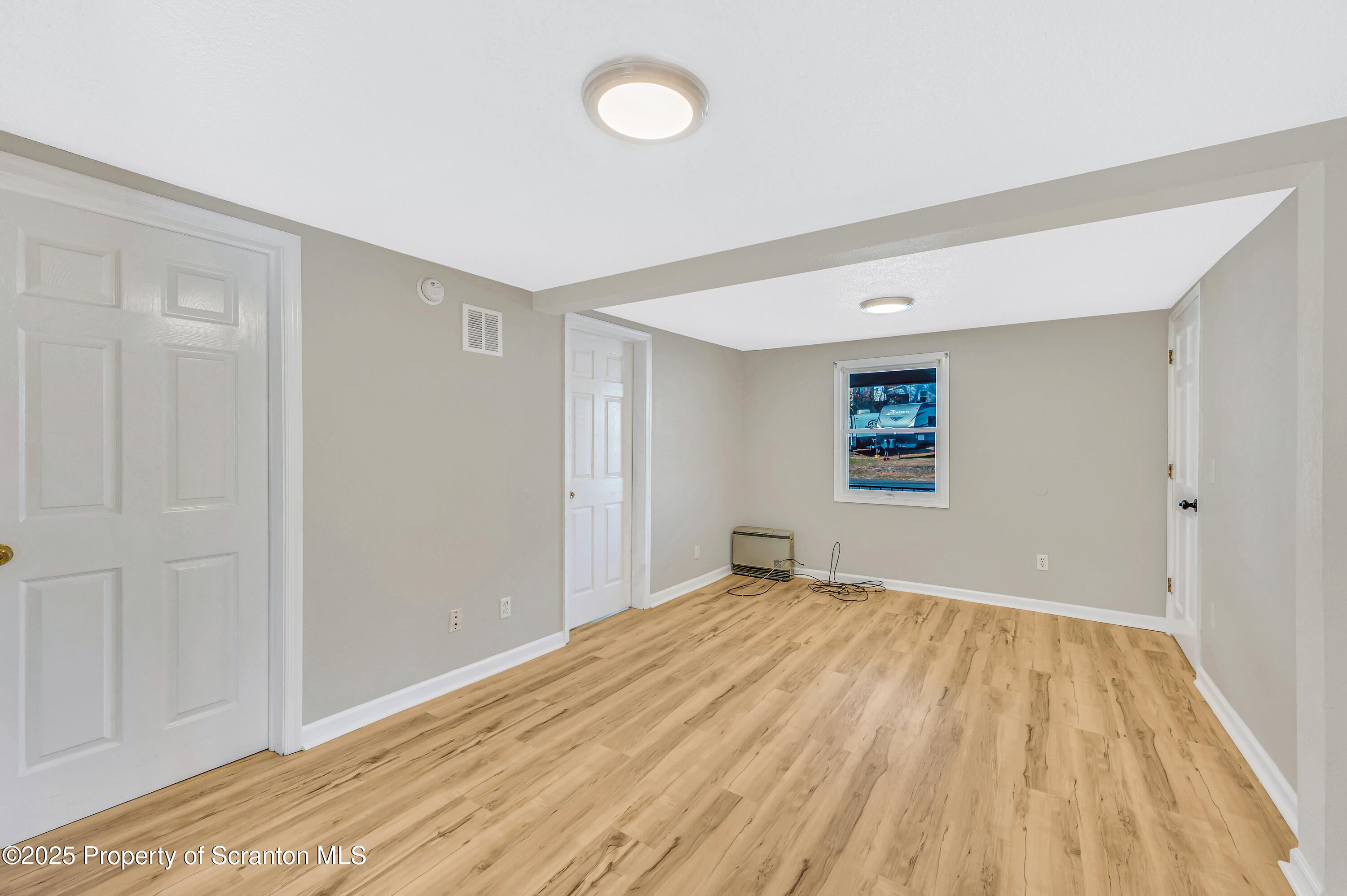 1120 Prescott Avenue, Unit 1 Dunmore, PA 18510 - Photo 11 of 16 a view of empty room with wooden floor