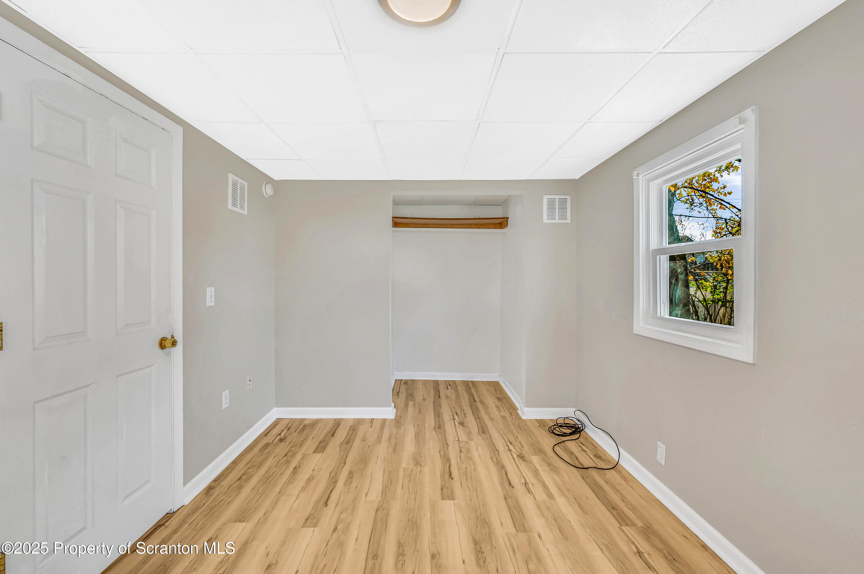 1120 Prescott Avenue, Unit 1 Dunmore, PA 18510 - Photo 16 of 16 a view of a room with wooden floor and a window