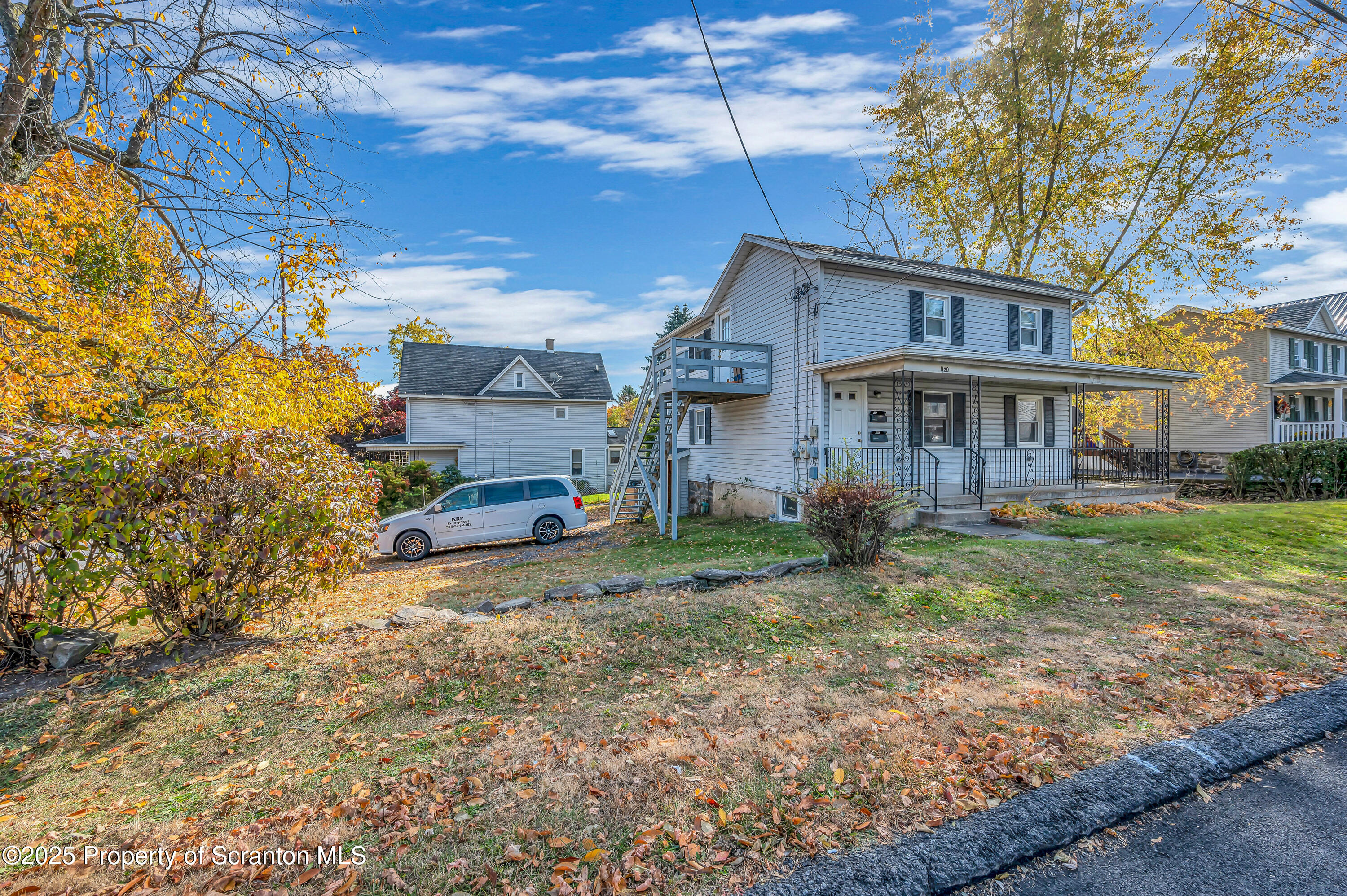1120 Prescott Avenue, Unit 1 Dunmore, PA 18510 - Photo 3 of 16 a view of a house with a yard