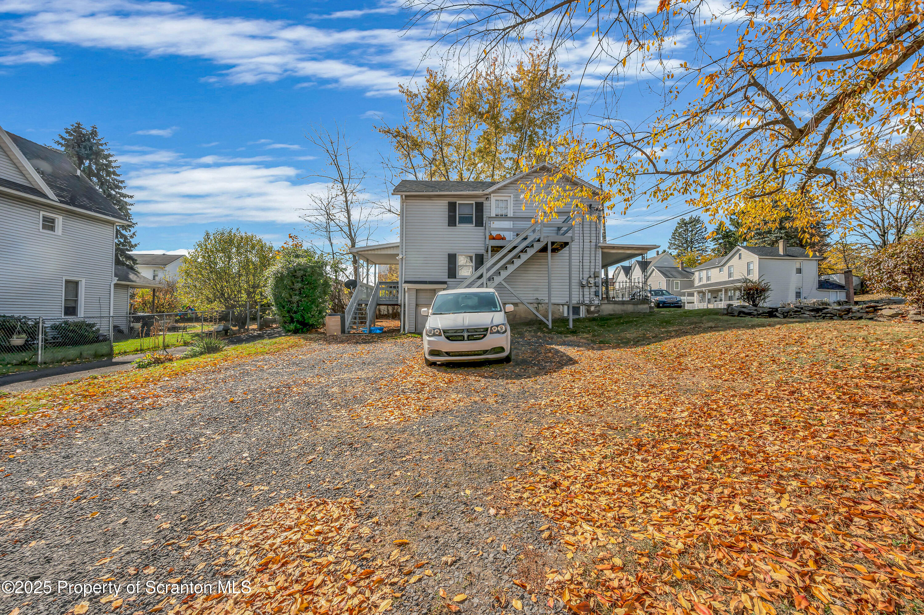 1120 Prescott Avenue, Unit 1 Dunmore, PA 18510 - Photo 4 of 16 a front view of a house with a yard