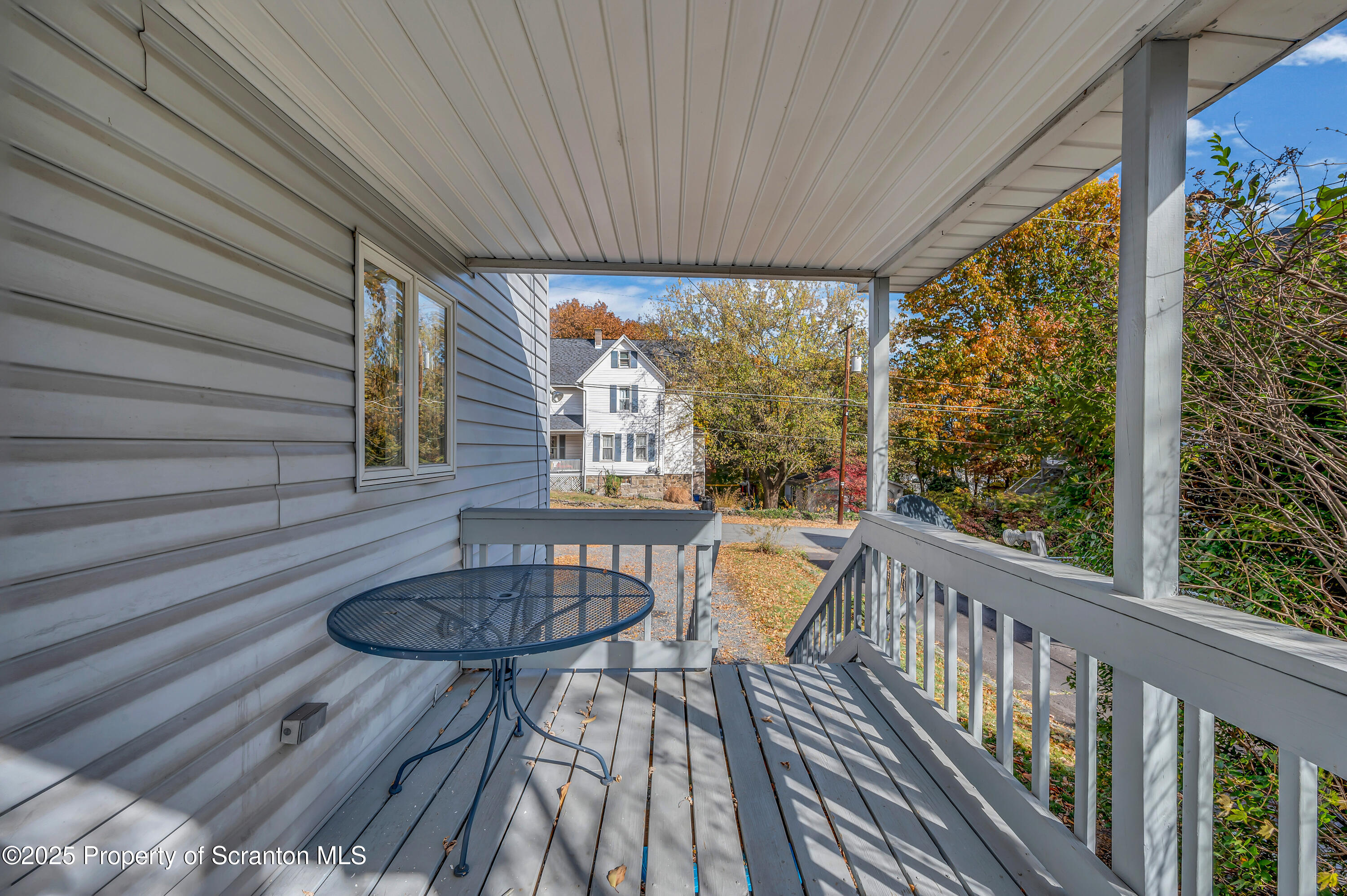 1120 Prescott Avenue, Unit 1 Dunmore, PA 18510 - Photo 6 of 16 a balcony with table and chairs