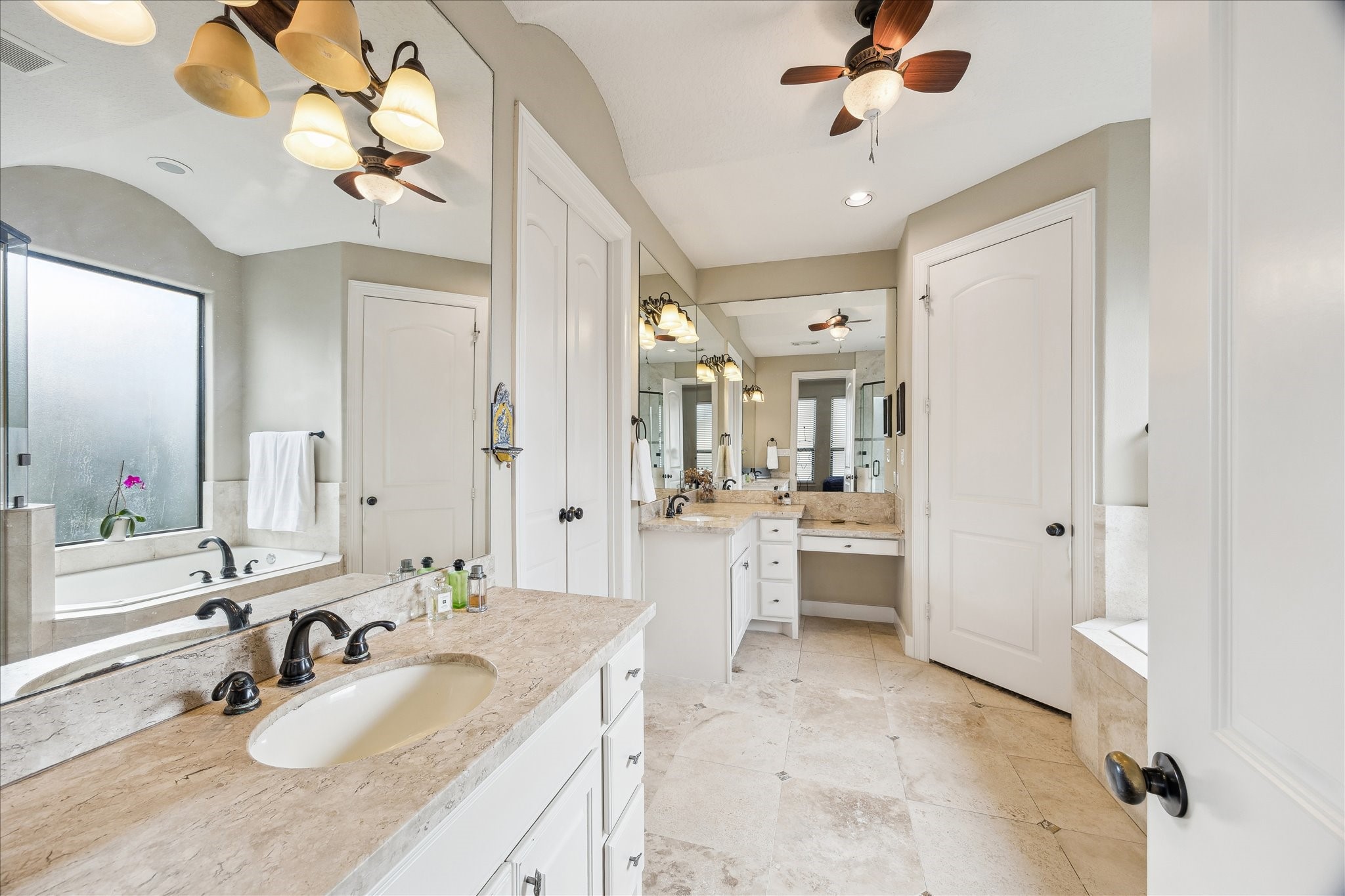6311 Hamman Street, Unit A Houston, TX 77007 - Photo 15 of 30 a large bathroom with a granite countertop sink a large mirror and shower