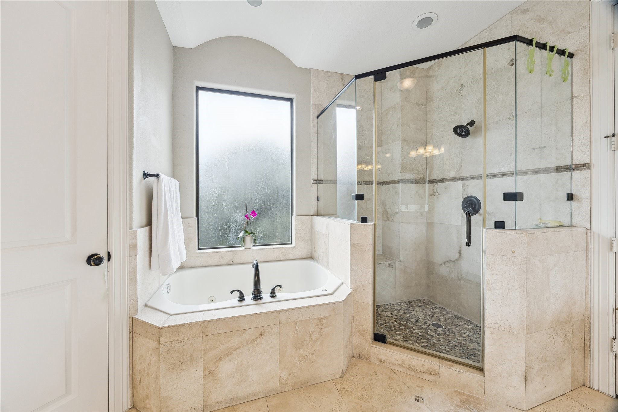 6311 Hamman Street, Unit A Houston, TX 77007 - Photo 16 of 30 a bathroom with a bathtub and a shower