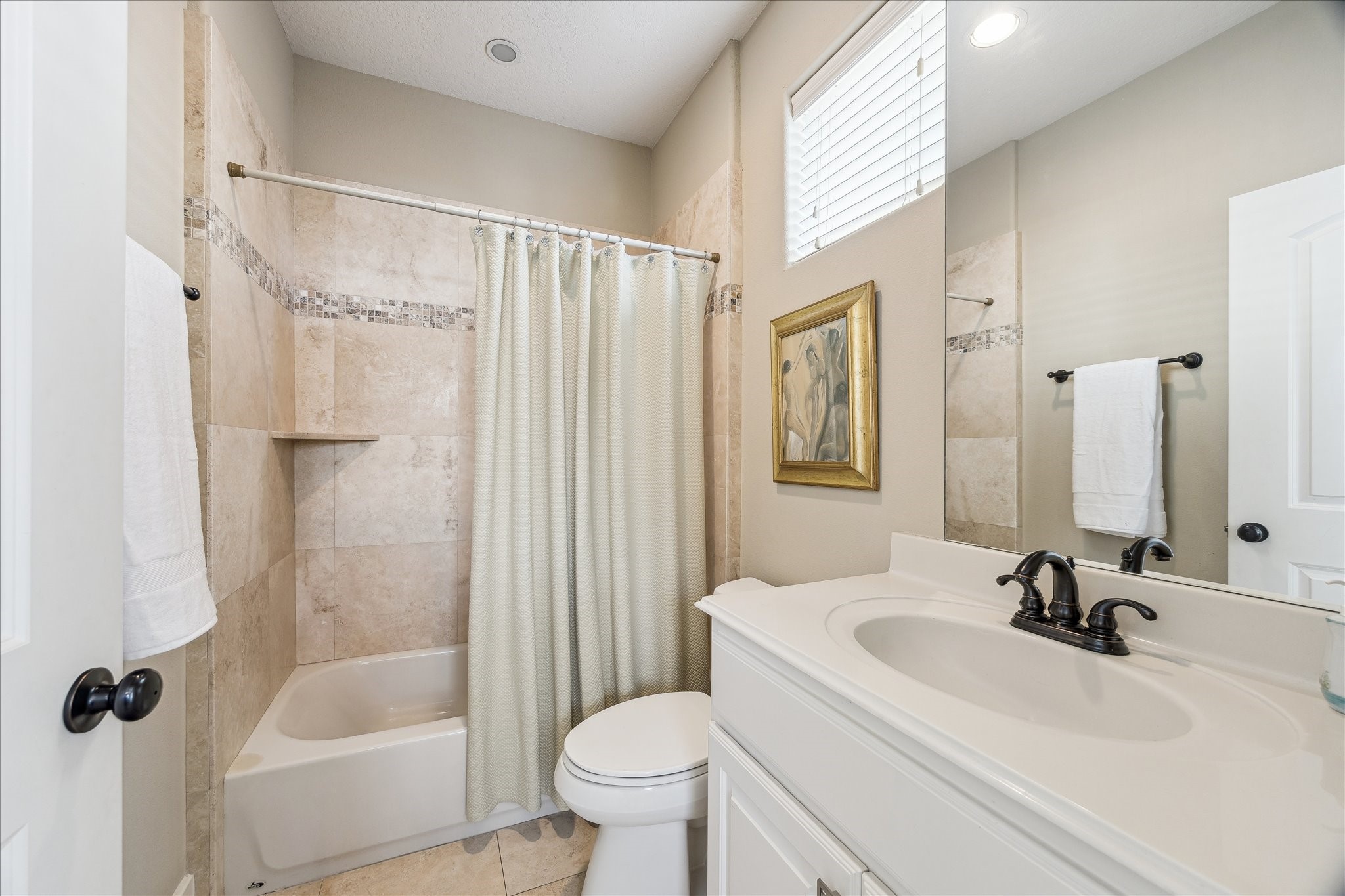 6311 Hamman Street, Unit A Houston, TX 77007 - Photo 18 of 30 a bathroom with a sink toilet and shower