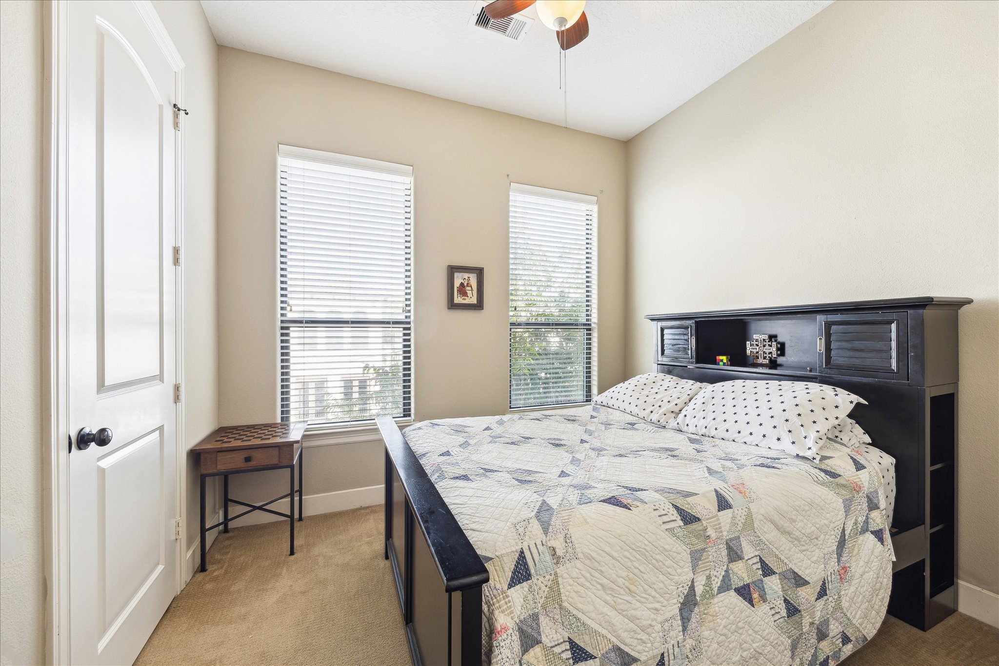6311 Hamman Street, Unit A Houston, TX 77007 - Photo 19 of 30 a bedroom with a bed and a window
