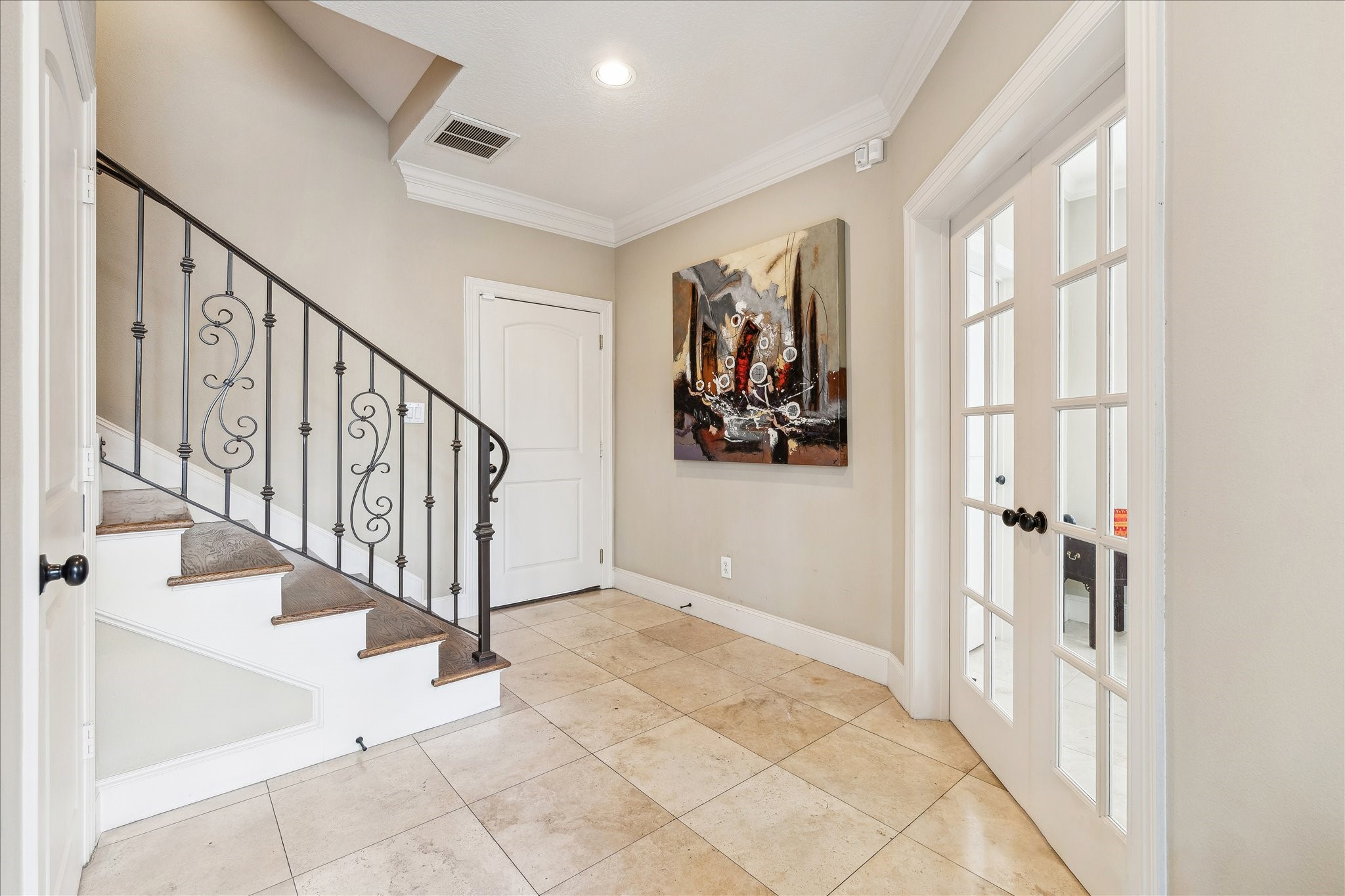 6311 Hamman Street, Unit A Houston, TX 77007 - Photo 6 of 30 a view of staircase with lots of frames on wall and a large window
