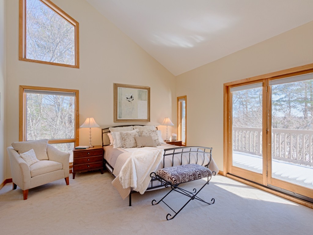 14 Skunk Road Merrimac, MA 01860 - Photo 12 of 25 a bedroom with furniture and a large window