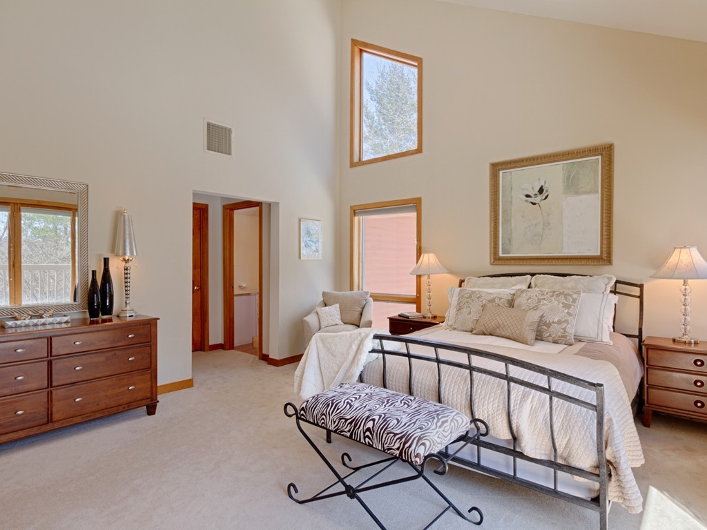 14 Skunk Road Merrimac, MA 01860 - Photo 13 of 25 a bedroom with a bed and furniture with mirror