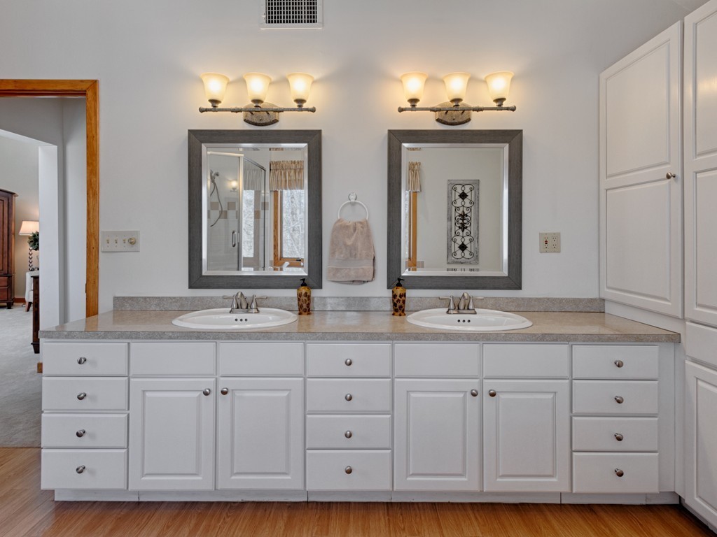 14 Skunk Road Merrimac, MA 01860 - Photo 14 of 25 a bathroom with white cabinets and a sink