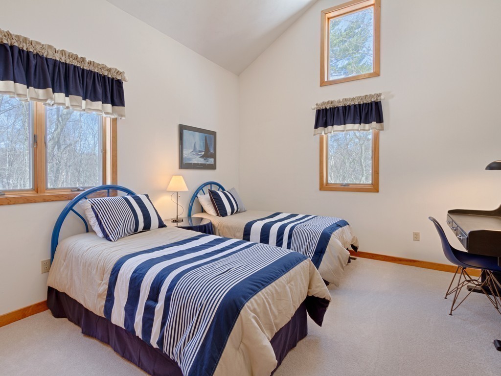 14 Skunk Road Merrimac, MA 01860 - Photo 16 of 25 a bedroom with two beds and a desk next to a window