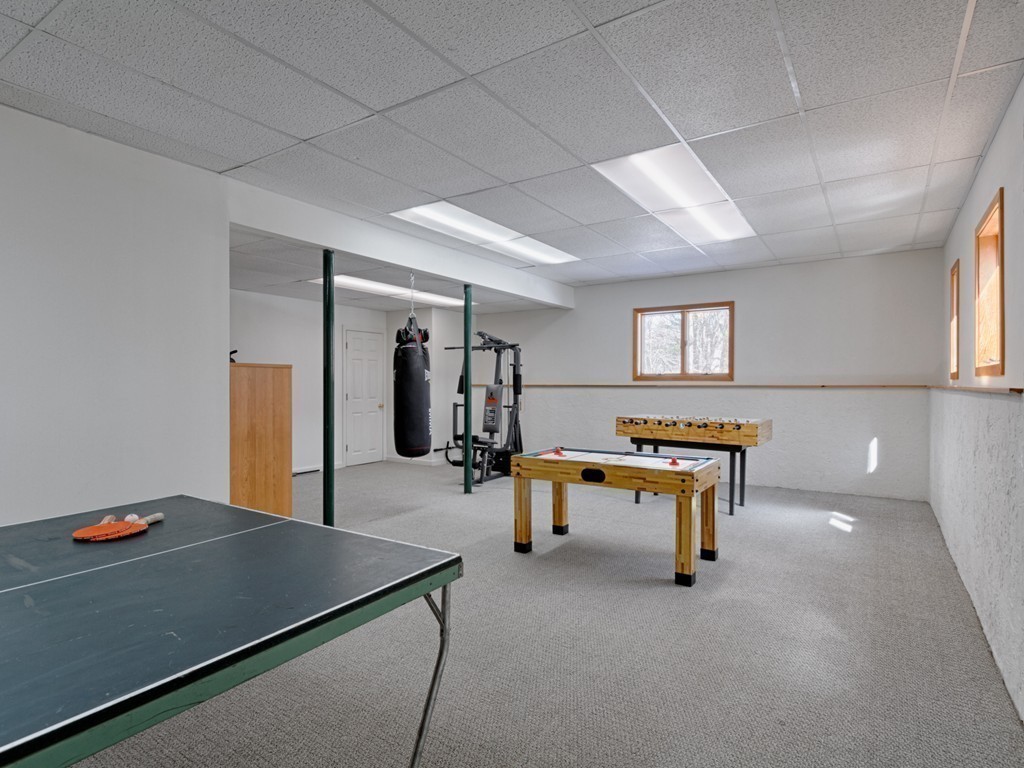 14 Skunk Road Merrimac, MA 01860 - Photo 20 of 25 a living room with furniture and a table