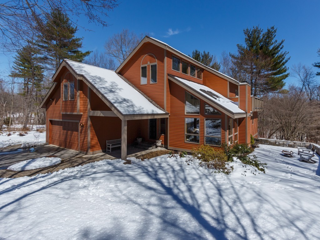 14 Skunk Road Merrimac, MA 01860 - Photo 2 of 25 a front view of a house with a yard