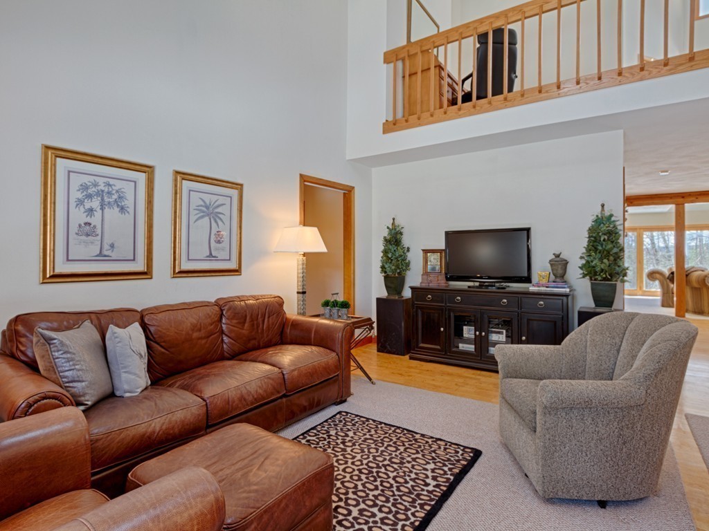14 Skunk Road Merrimac, MA 01860 - Photo 6 of 25 a living room with furniture and a flat screen tv