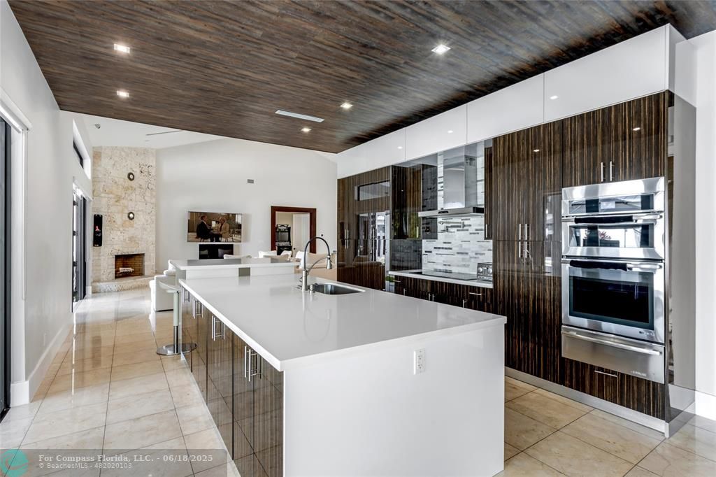 6901 Holatee Trail Southwest Ranches, FL 33330 - Photo 16 of 45 a large kitchen with stainless steel appliances a large counter top