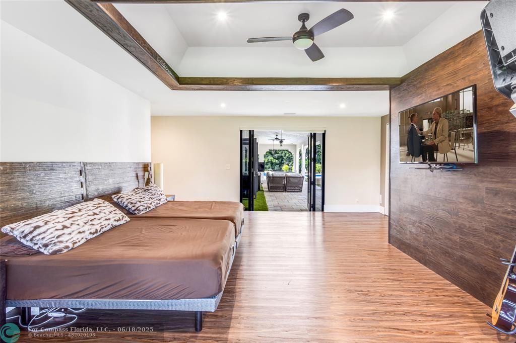 6901 Holatee Trail Southwest Ranches, FL 33330 - Photo 19 of 45 a bedroom with a bed and glass door