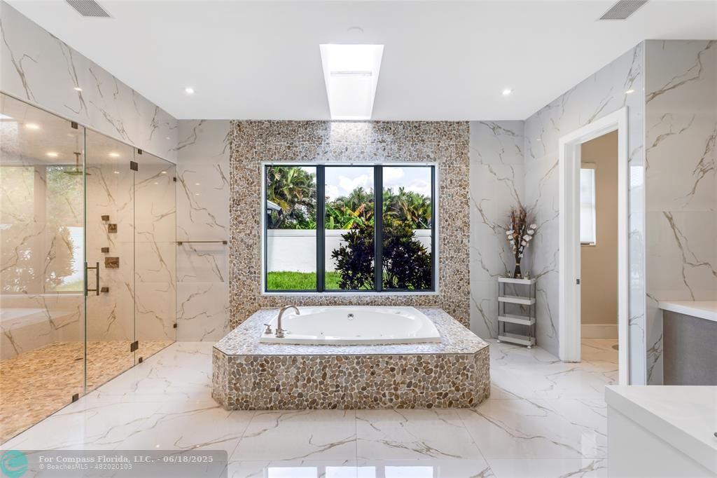 6901 Holatee Trail Southwest Ranches, FL 33330 - Photo 20 of 45 a spacious bathroom with a tub and a shower