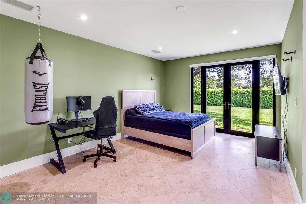 6901 Holatee Trail Southwest Ranches, FL 33330 - Photo 23 of 45 a spacious bedroom with a bed and a window