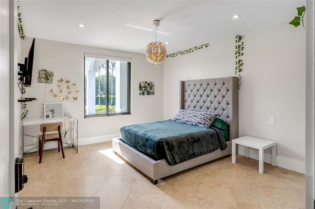 6901 Holatee Trail Southwest Ranches, FL 33330 - Photo 25 of 45 a bedroom with a bed and a table in it with window