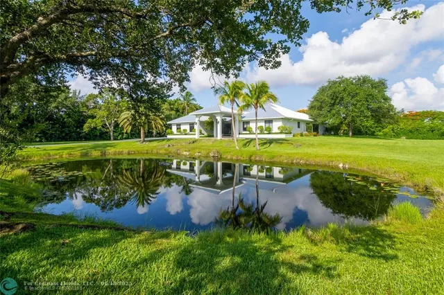 an aerial view of a house with a garden