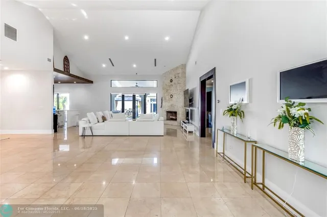 a view of a living room and kitchen
