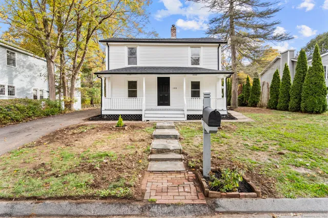 a front view of a house with a yard