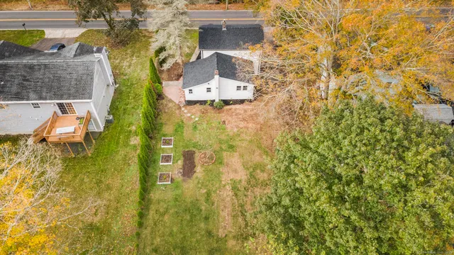 a aerial view of a residential apartment building with a yard