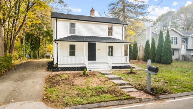 a front view of a house with a yard